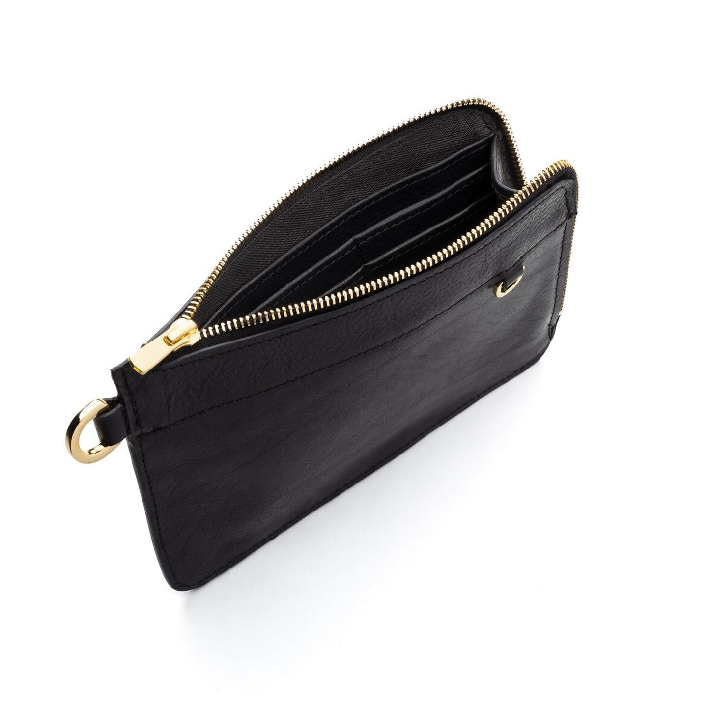 Pochette en cuir ou sac à main avec sa lanière amovible. Maroquinerie en cuir fabriquée en France. Atelier de maroquinerie à Paris. Boutique créateur Paris. Mode éco responsable et locale. Sac à main personnalisable. Pochette personnalisable. Petite maroquinerie personnalisable. Idée cadeau made in France.