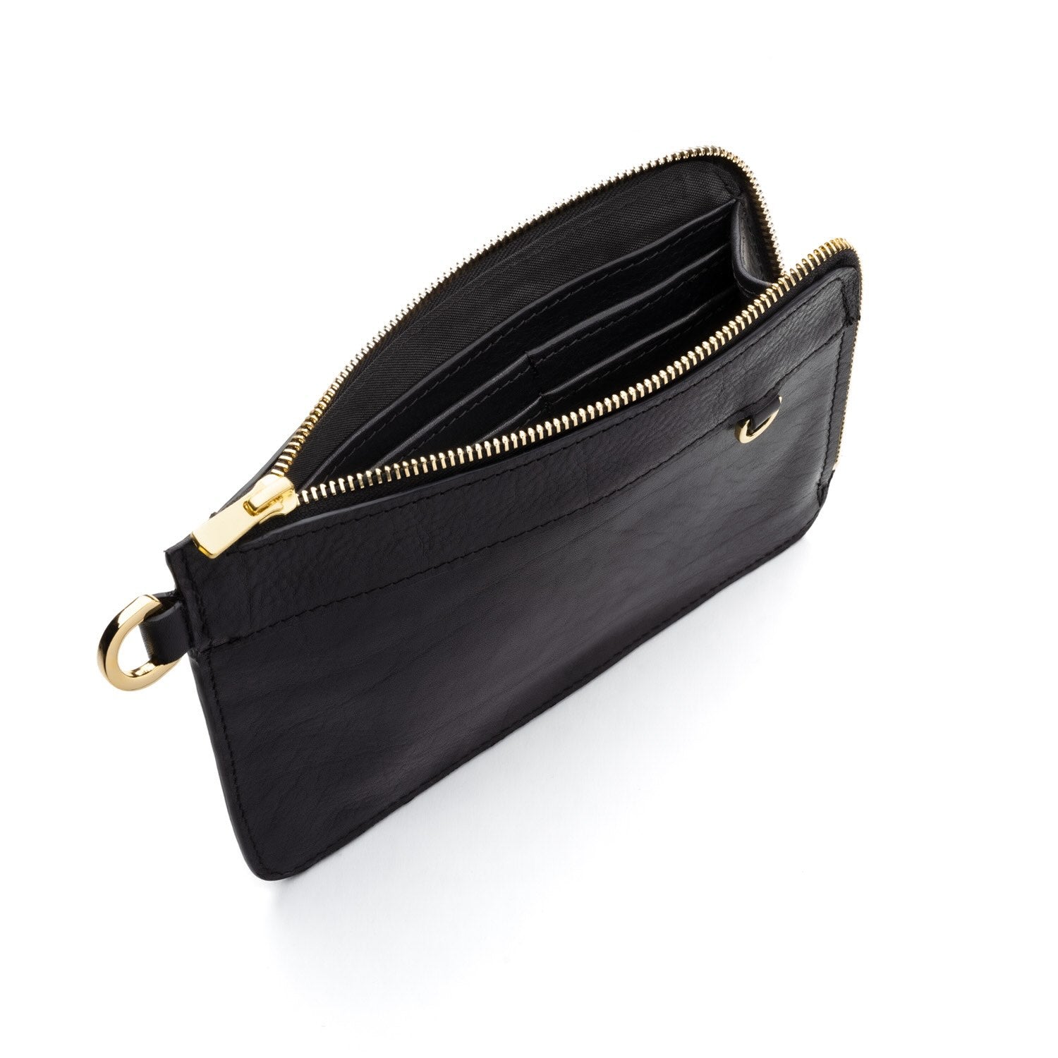 Pochette en cuir ou sac à main avec sa lanière amovible. Maroquinerie en cuir fabriquée  en France. Atelier de maroquinerie à Paris. Boutique créateur Paris. Mode éco responsable et locale. Sac à main personnalisable. Pochette personnalisable. Petite maroquinerie personnalisable. Idée cadeau made in France.