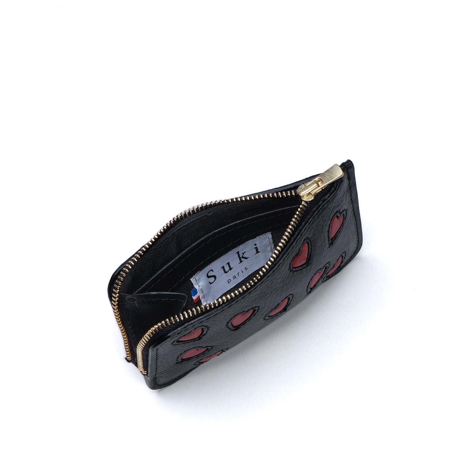 Atelier de maroquinerie à Paris. Porte-monnaie en cuir made in France. Maroquinerie française idéale pour idée cadeau homme ou femme. Accessoire personnalisable. Boutique maroquinerie Paris 17. Atelier créateur Champs Elysées.