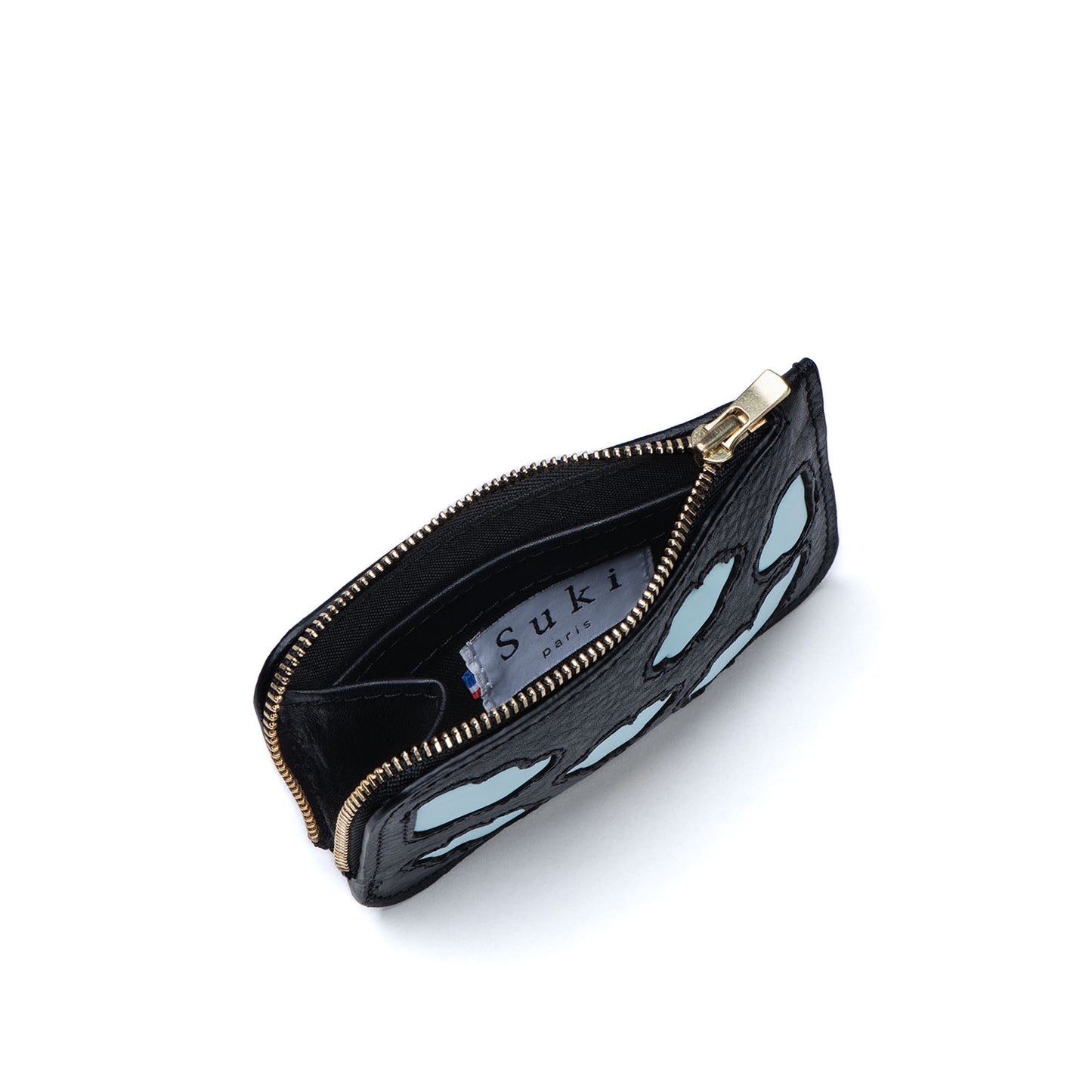 Atelier de maroquinerie à Paris. Porte-monnaie en cuir italien chic et pratique au design unique et made in France. Petite maroquinerie française parfaite pour des idées cadeaux. Maroquinerie pour homme et femme. Pochette en cuir personnalisable. Boutique de maroquinerie à Paris.