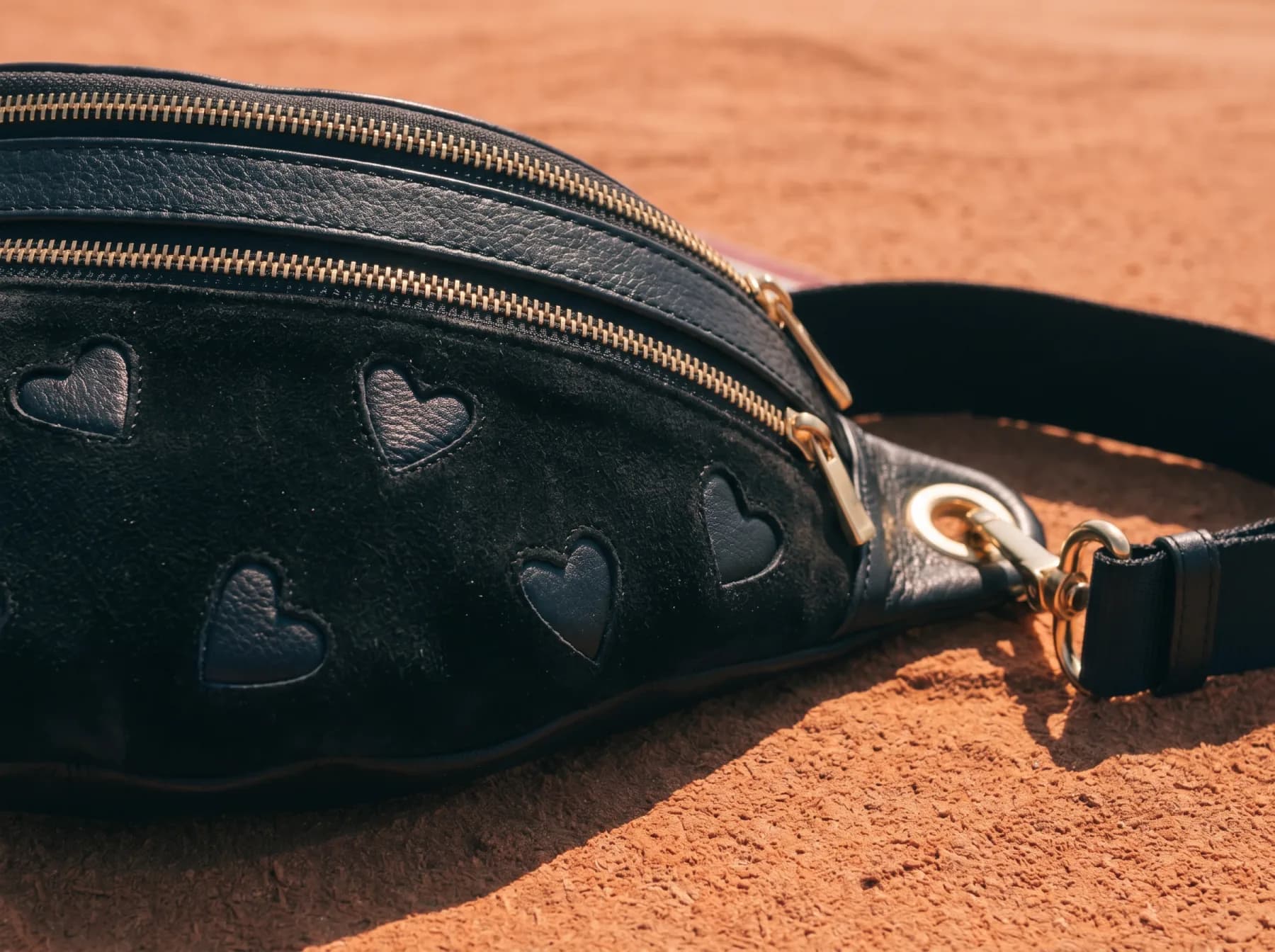 Ulysse leather shoulder bag in black — worn crossbody, Suki Paris